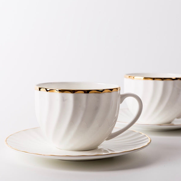 Elegant White Tea Cup and Saucer with Gold Detail - Staunton and Henry