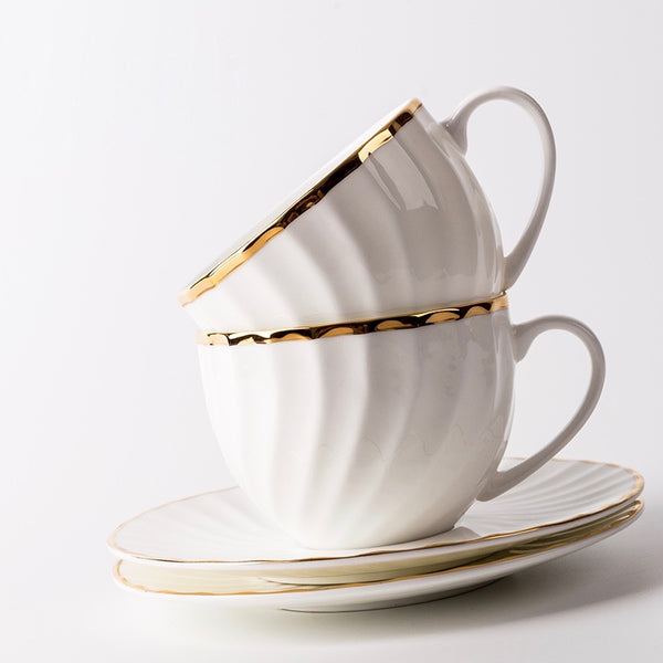 Elegant White Tea Cup and Saucer with Gold Detail - Staunton and Henry