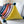 Load image into Gallery viewer, Triangle Pom Pom Cushion - Staunton and Henry
