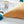 Load image into Gallery viewer, Triangle Pom Pom Cushion - Staunton and Henry