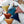 Load image into Gallery viewer, Triangle Pom Pom Cushion - Staunton and Henry