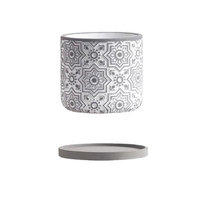 Decorative pot with geometric pattern on a white background