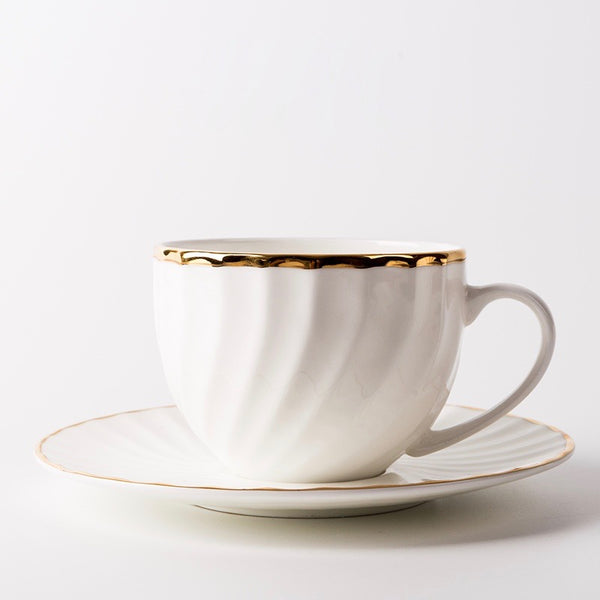 Elegant White Tea Cup and Saucer with Gold Detail - Staunton and Henry
