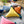 Load image into Gallery viewer, Triangle Pom Pom Cushion - Staunton and Henry
